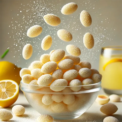 Keto Store NZ | Better Than Good Foods | Chocolate Almonds | Limoncello | Glass bowl filled with limoncello Almonds with a glass of lemonade and lemons in the background.