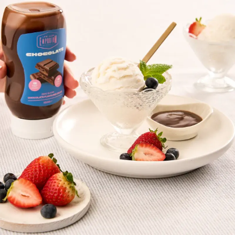 Keto Store NZ | Low Carb Emporium | Chocolate Sauce with a dessert featuring ice cream, strawberries, and blueberries