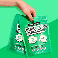Keto Store NZ | Max Mallow | Marshmallows | Mint Chip flavour with collagen and MCT oil | Green package of Max Mallow mint chip marshmallows held by a hand on a green background