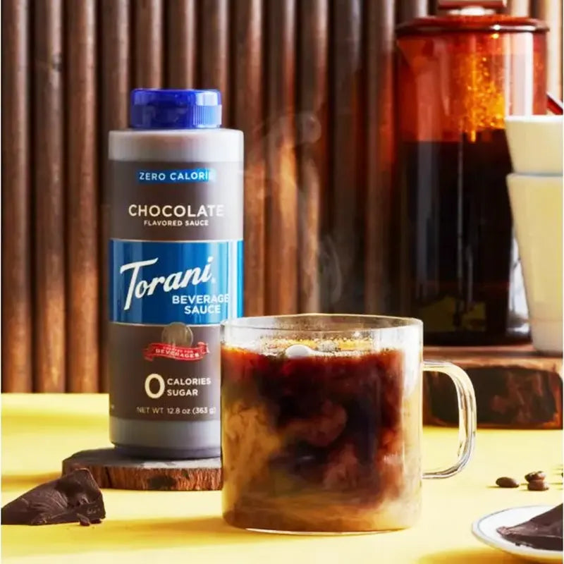 Keto Store NZ | Torani Chocolate Sauce | Torani chocolate sauce bottle next to a glass of iced coffee